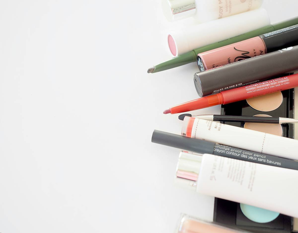 Organized essential makeup kit inside a premium waterproof makeup bag with labeled compartments